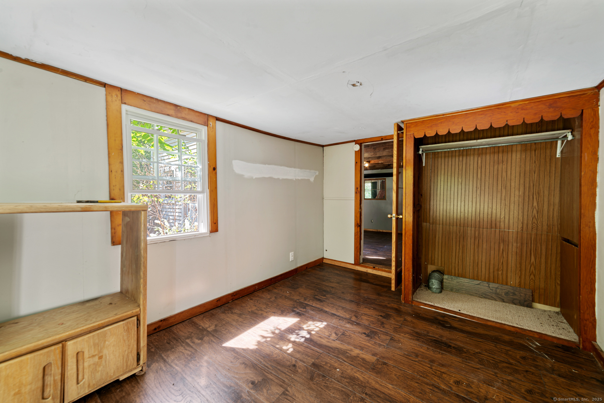28 Trumbull Street Litchfield, CT 06750 - Photo 20 of 23 an empty room with wooden floor cabinet and windows