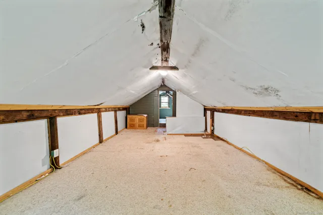 a view of an empty room with windows