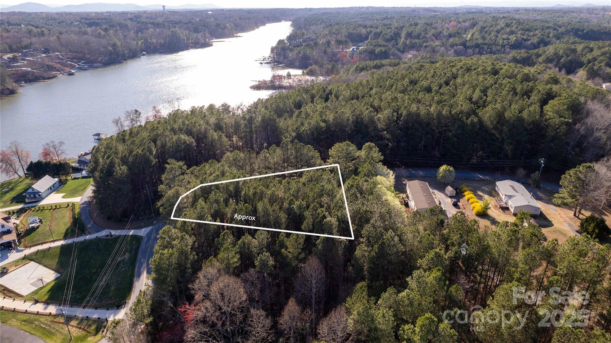 5126 Hurricane Hill Road, Unit 25 Granite Falls, NC 28630 - Photo 7 of 12 a view of a lake and a mountain view