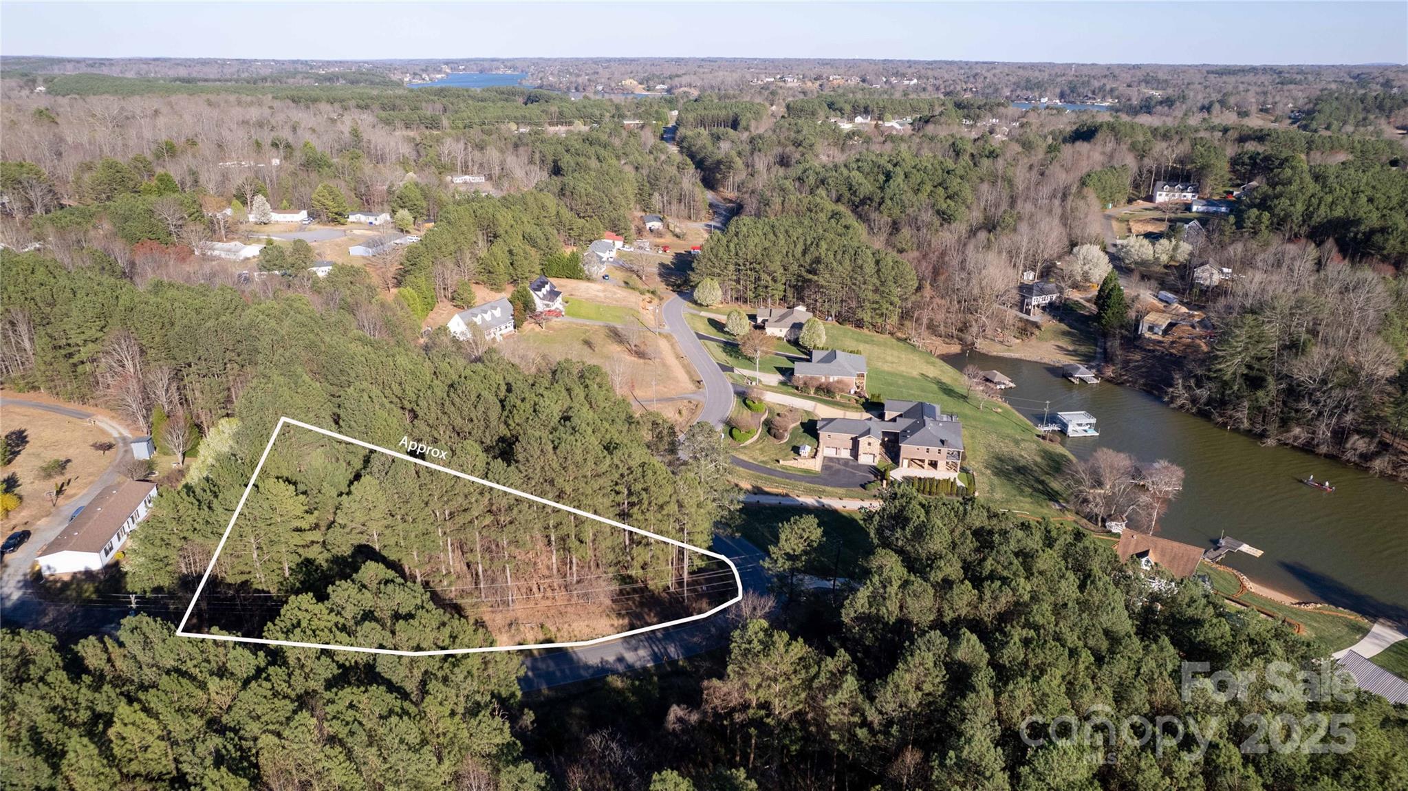 5126 Hurricane Hill Road, Unit 25 Granite Falls, NC 28630 - Photo 9 of 12 an aerial view of a house with a yard and lake view