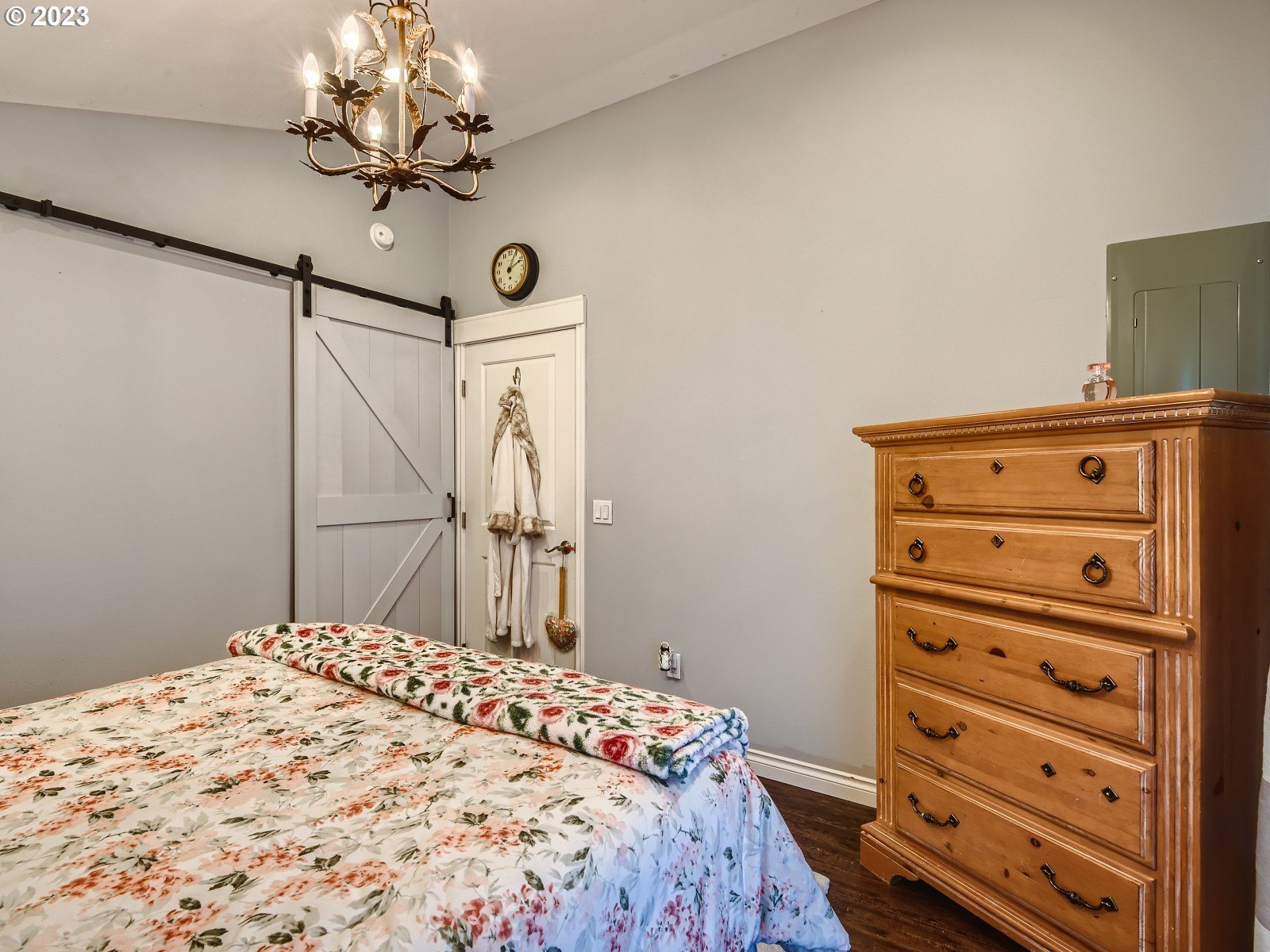 1830 Southeast Christensen Road Corbett, OR 97019 - Photo 14 of 28 a bedroom with a bed and a chandelier