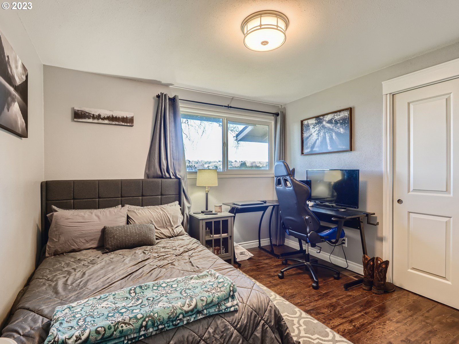 1830 Southeast Christensen Road Corbett, OR 97019 - Photo 18 of 28 a bedroom with a large bed and wooden floor