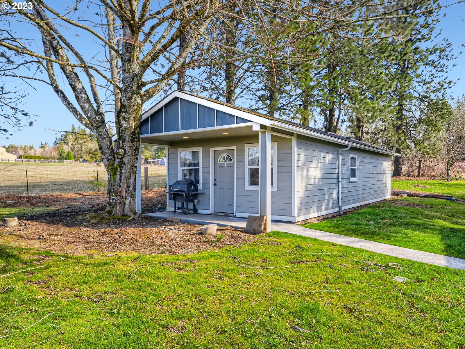 1830 Southeast Christensen Road Corbett, OR 97019 - Photo 24 of 28 a view of a house with backyard and tree