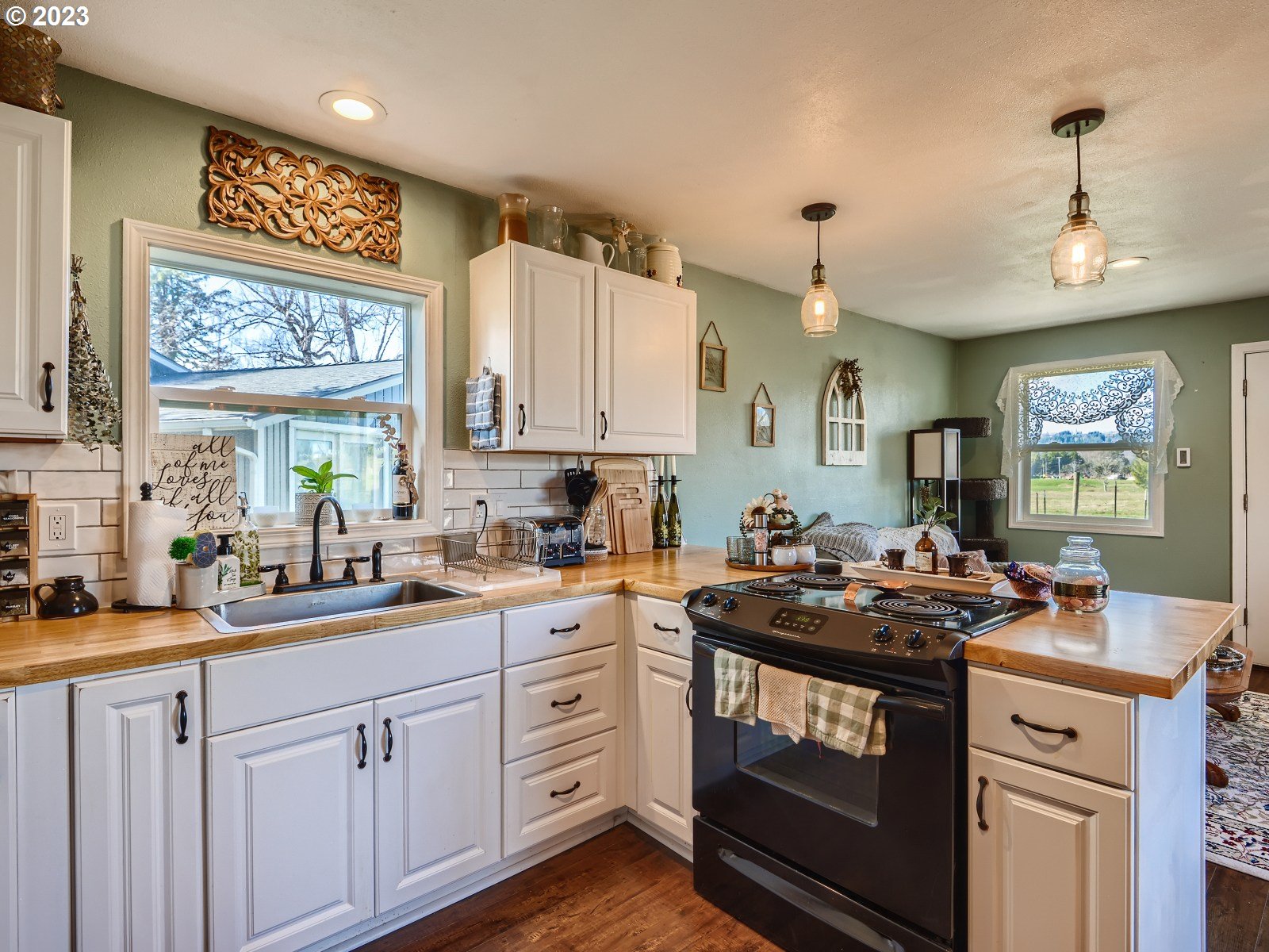 1830 Southeast Christensen Road Corbett, OR 97019 - Photo 26 of 28 a kitchen with a sink stove and cabinets