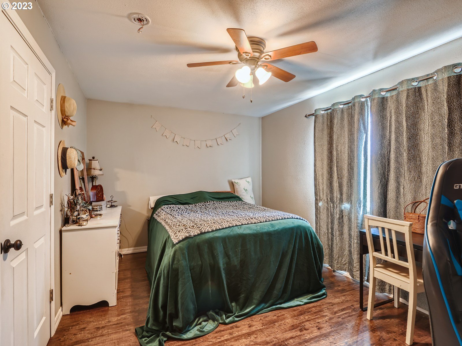1830 Southeast Christensen Road Corbett, OR 97019 - Photo 27 of 28 a bedroom with a bed and a chandelier