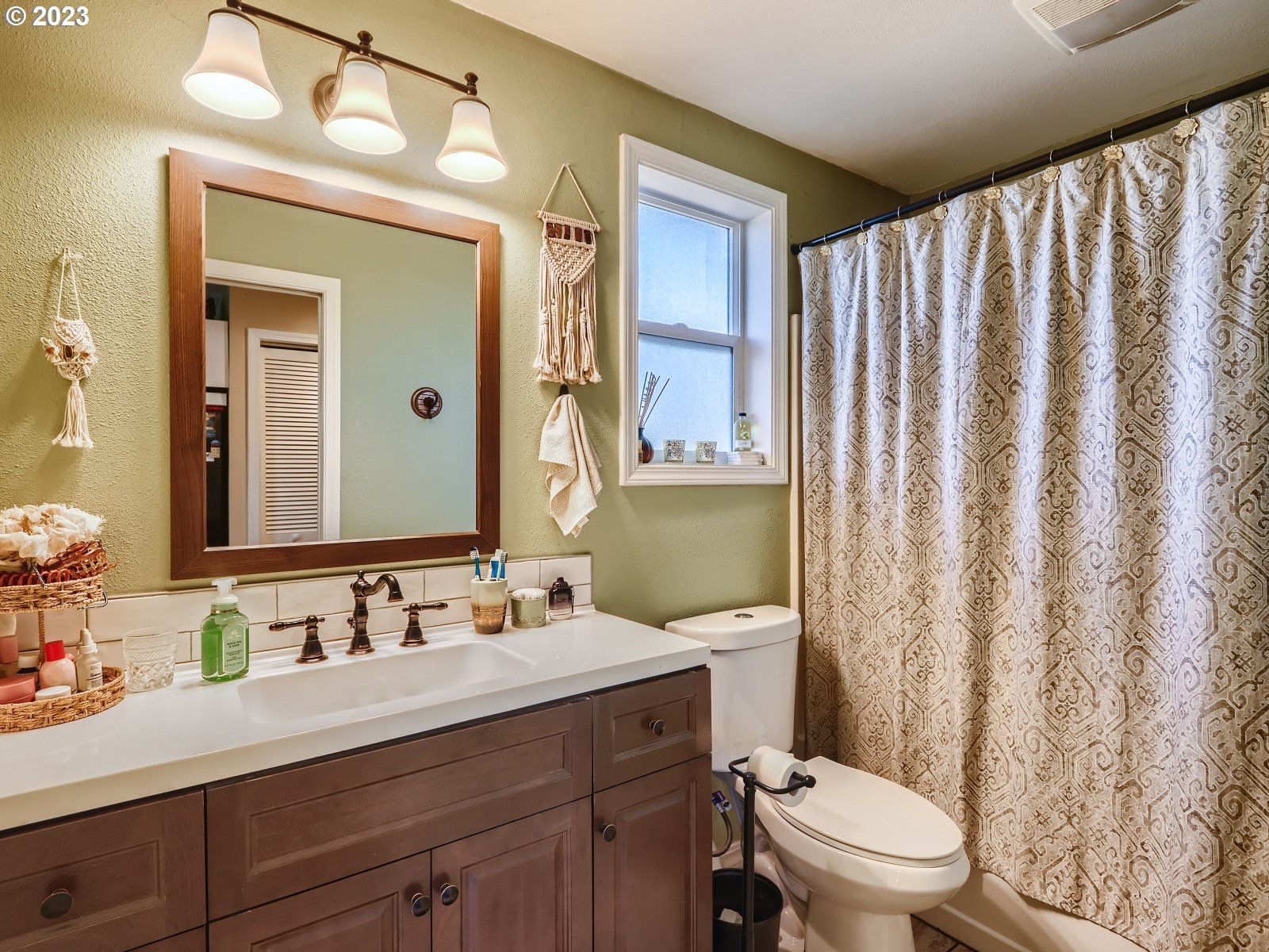1830 Southeast Christensen Road Corbett, OR 97019 - Photo 28 of 28 a bathroom with a granite countertop sink vanity mirror and toilet