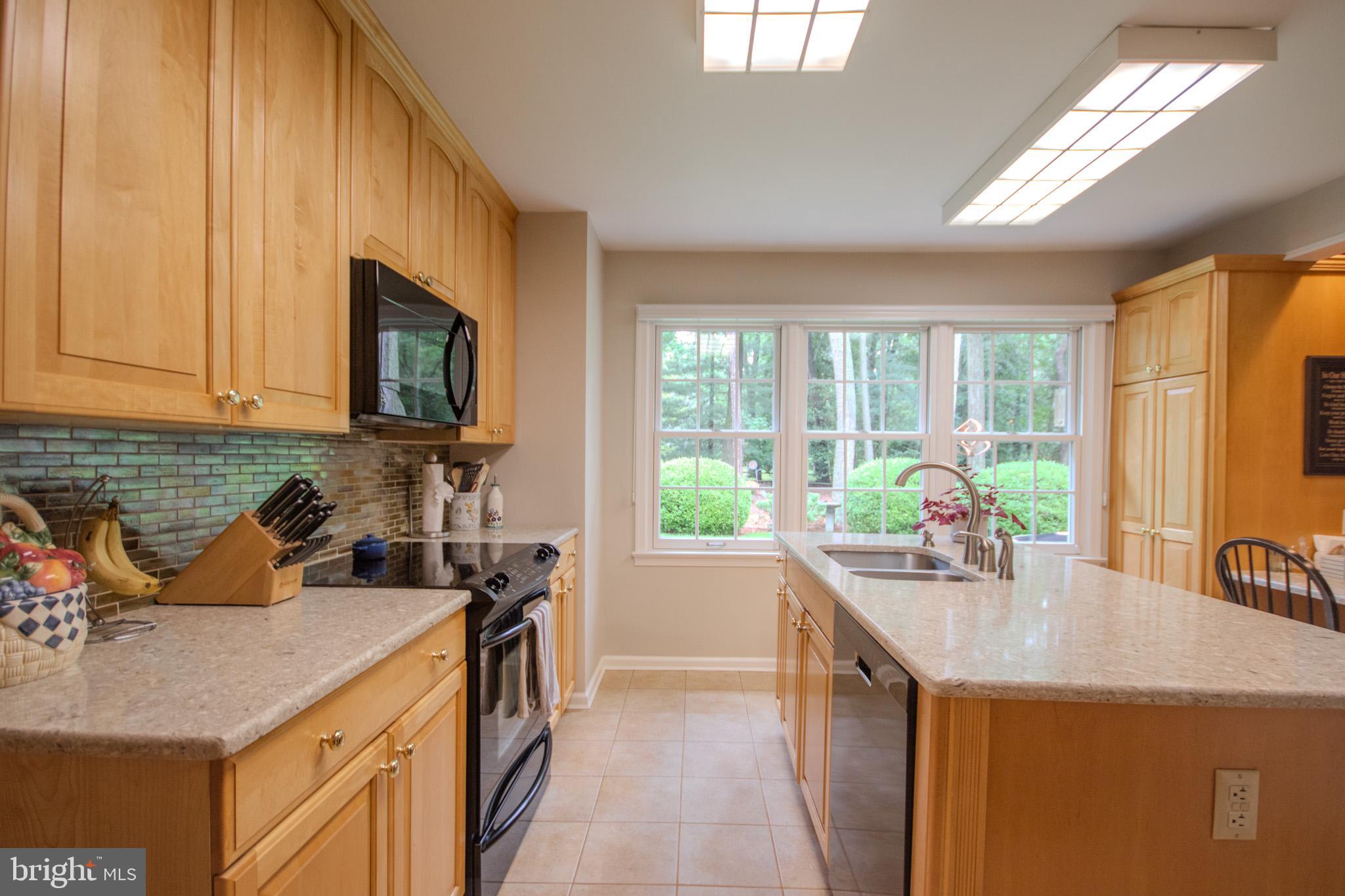 29745 Jackson Road Salisbury, MD 21804 - Photo 14 of 77 Kitchen with maple cabinets and quartz counters