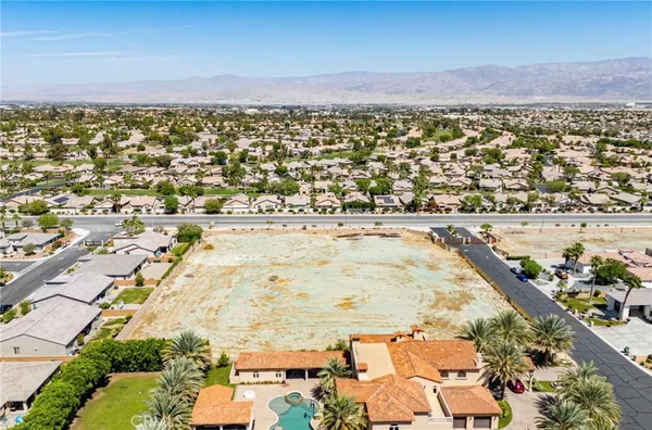 an aerial view of residential building and ocean