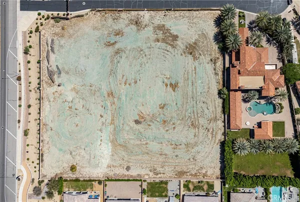 a aerial view of a house with a tree