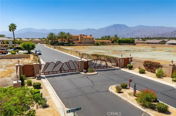 a view of a terrace with outdoor seating and city view