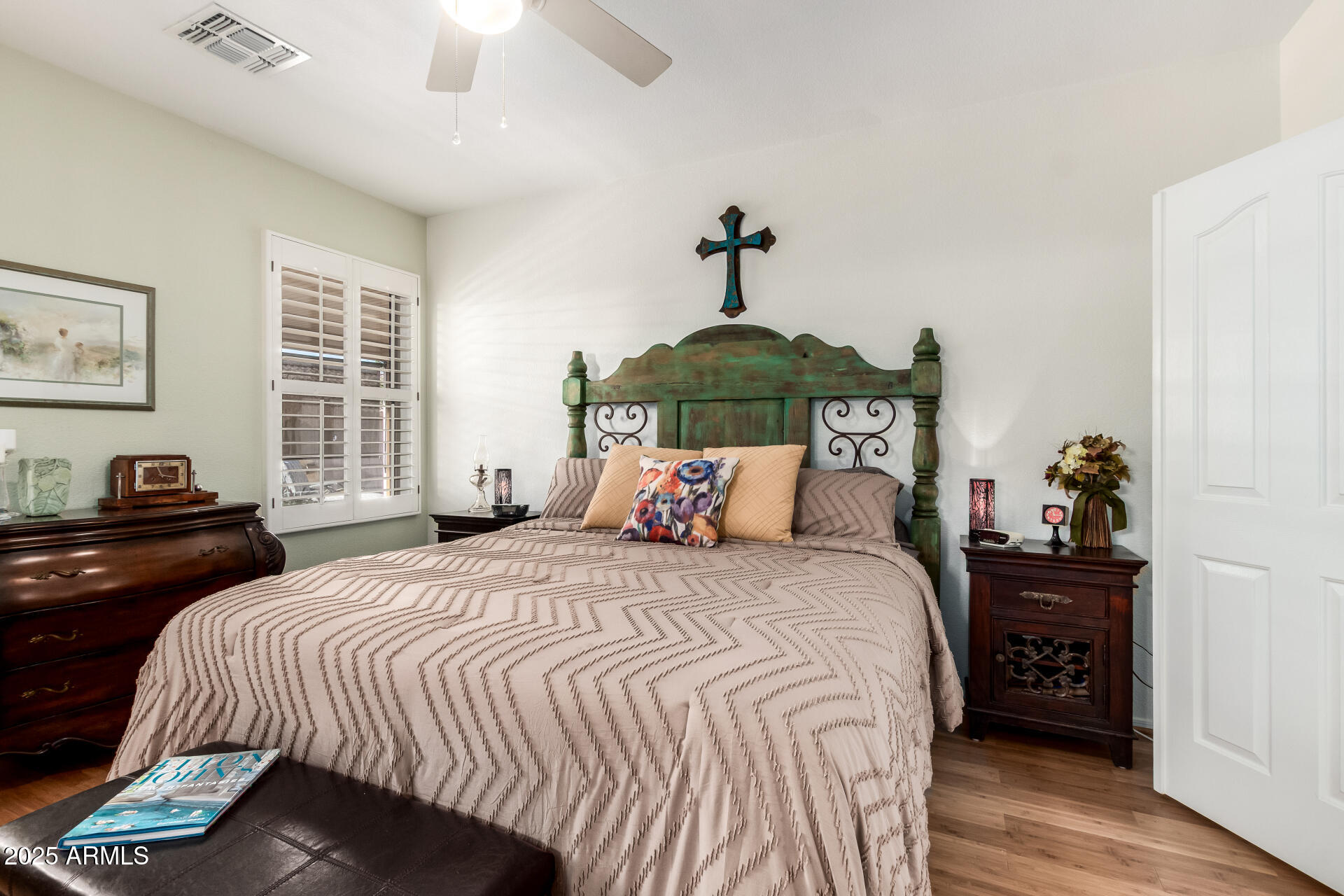 6972 South Nantucket Street Chandler, AZ 85249 - Photo 14 of 40 a bedroom with a bed and a chandelier