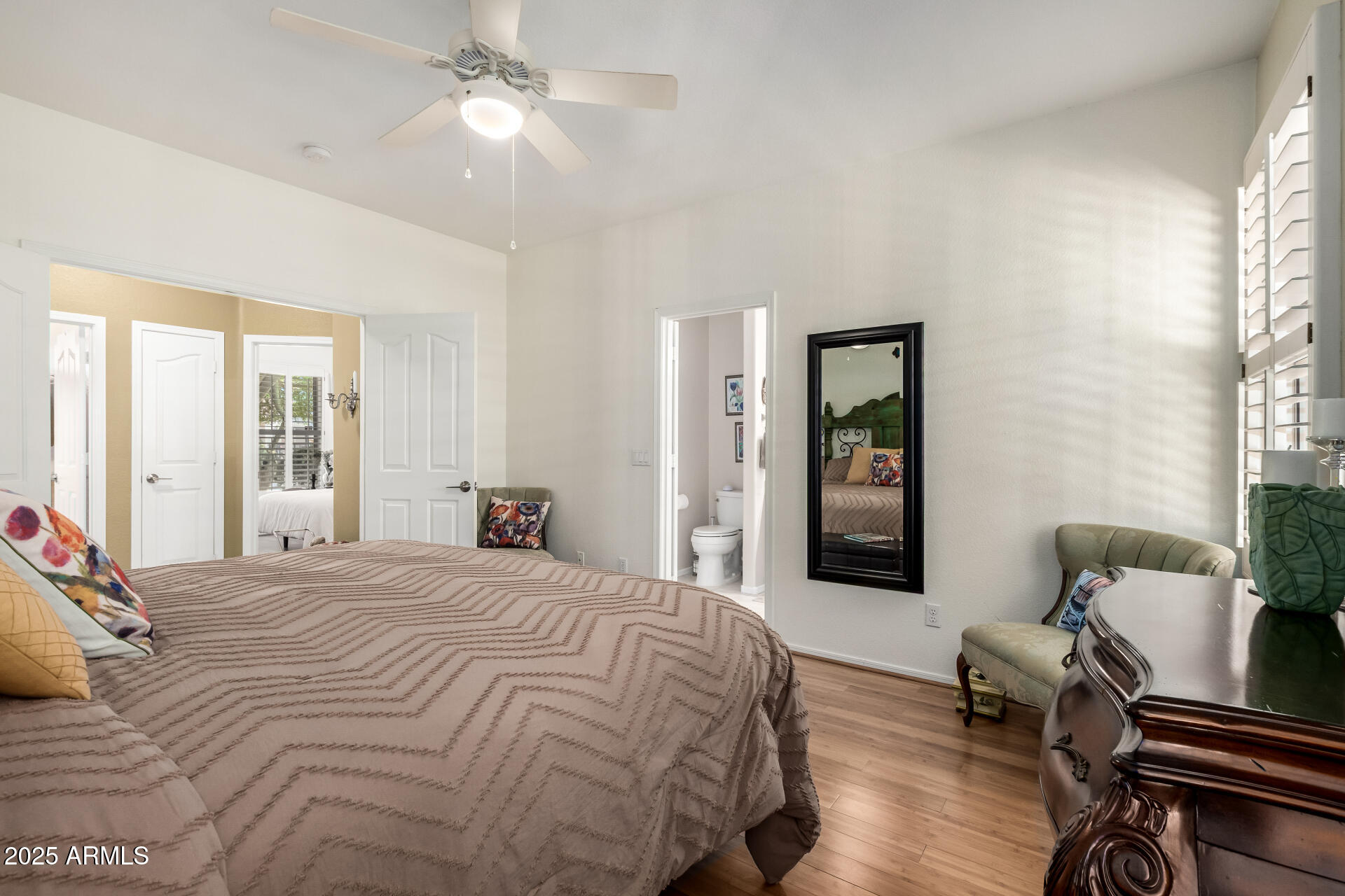 6972 South Nantucket Street Chandler, AZ 85249 - Photo 15 of 40 a bedroom with a bed and wooden floor