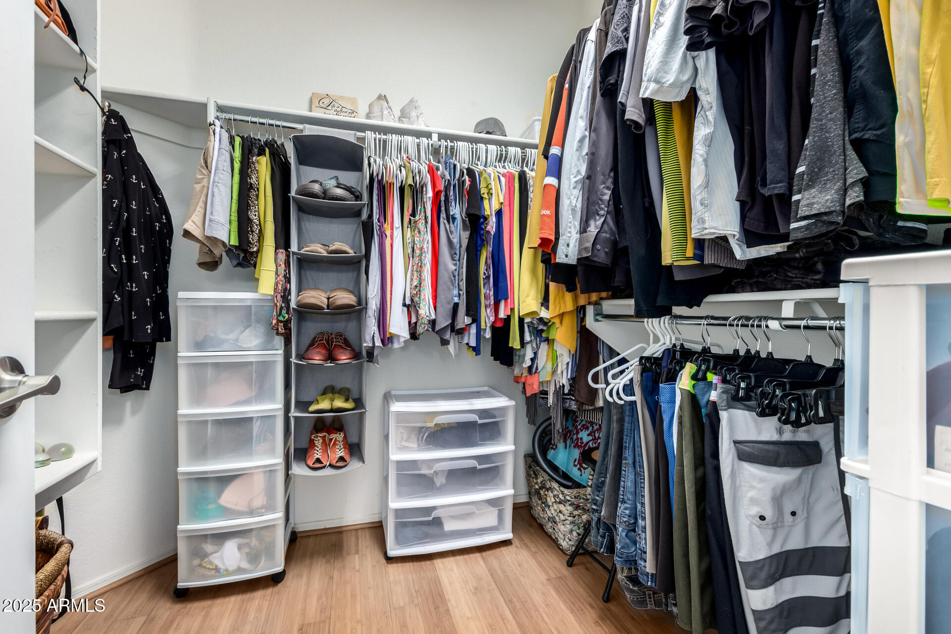 6972 South Nantucket Street Chandler, AZ 85249 - Photo 17 of 40 a view of walk in closet with clothes and shoes