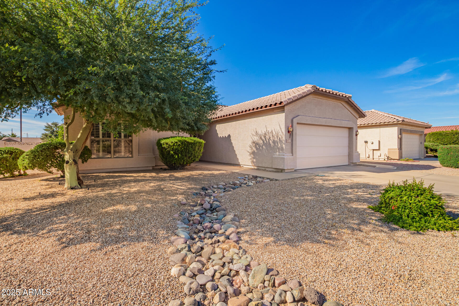 6972 South Nantucket Street Chandler, AZ 85249 - Photo 2 of 40 a view of a house with a yard
