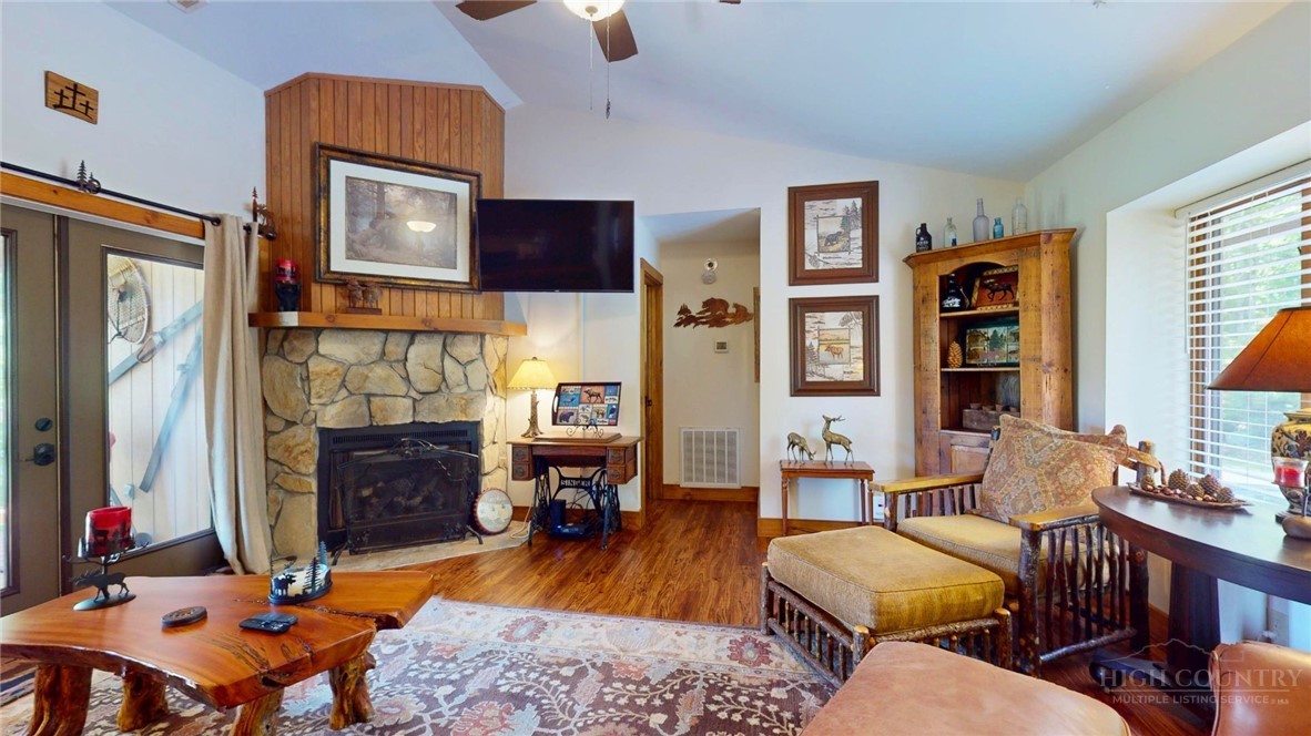 250 Ridgeview Road, Unit 43 Sugar Mountain, NC 28604 - Photo 1 of 21 a living room with fireplace furniture and a flat screen tv
