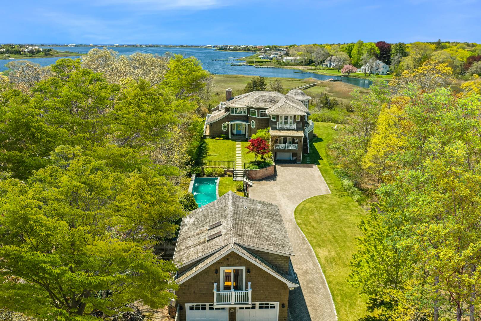 Undisclosed Address Westhampton Beach, NY 11978 - Photo 1 of 16 a view of a swimming pool with a lake view