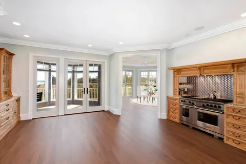 a view of kitchen with furniture wooden floor and window