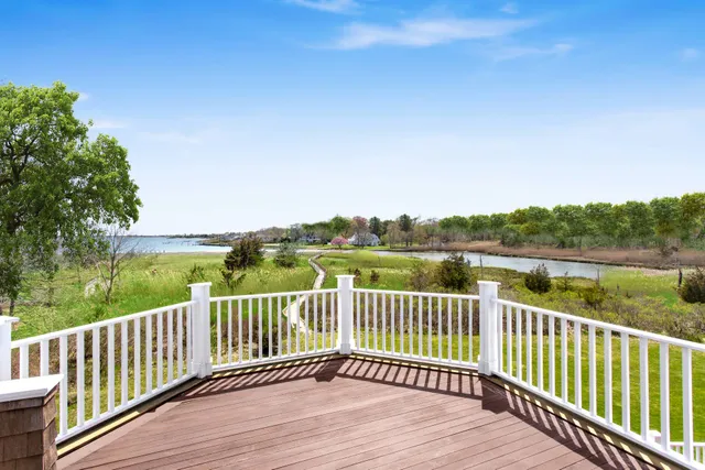 a view of a wooden deck with mountain view