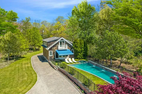 a view of swimming pool with a yard