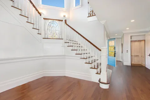 a view of entryway with wooden floor
