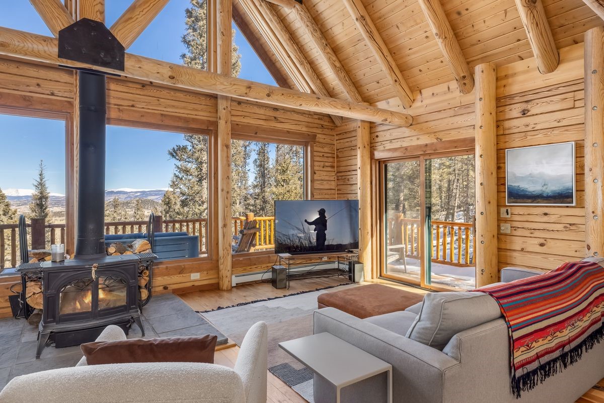 999 Bowstring Como, CO 80456 - Photo 3 of 37 a living room with furniture and a flat screen tv