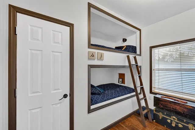 an aerial view of residential houses with outdoor space and swimming pool