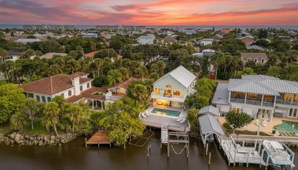 an aerial view of a city and ocean view