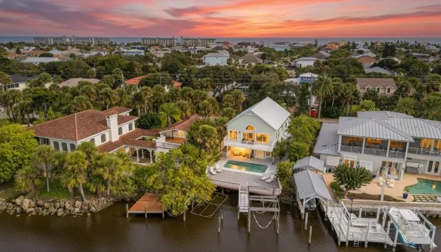 an aerial view of a city and ocean view