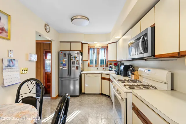 a kitchen with a refrigerator stove and a sink