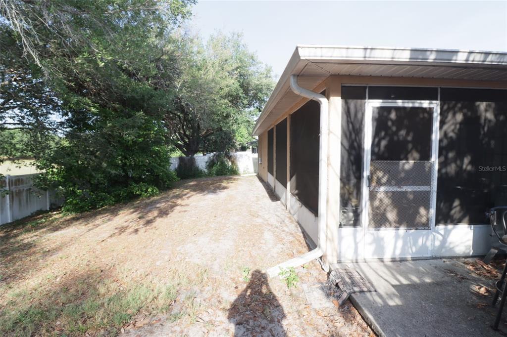 396 Kettering Road Deltona, FL 32725 - Photo 24 of 25 a view of a small house with yard