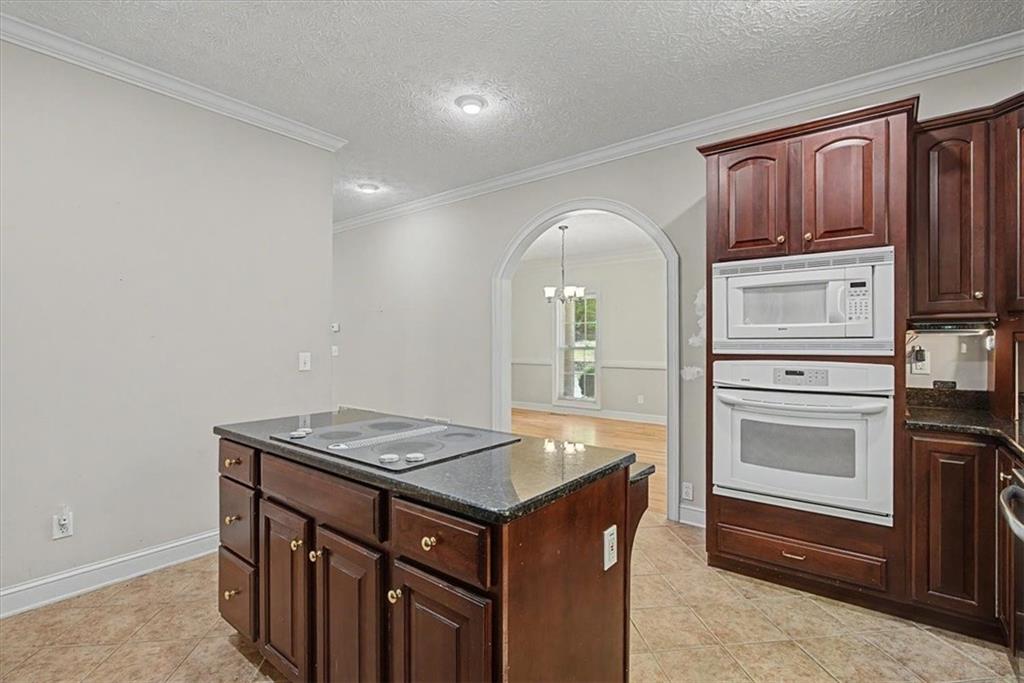 1136 Cole Lake Road Dallas, GA 30157 - Photo 24 of 72 a kitchen that has a sink and a stove in it