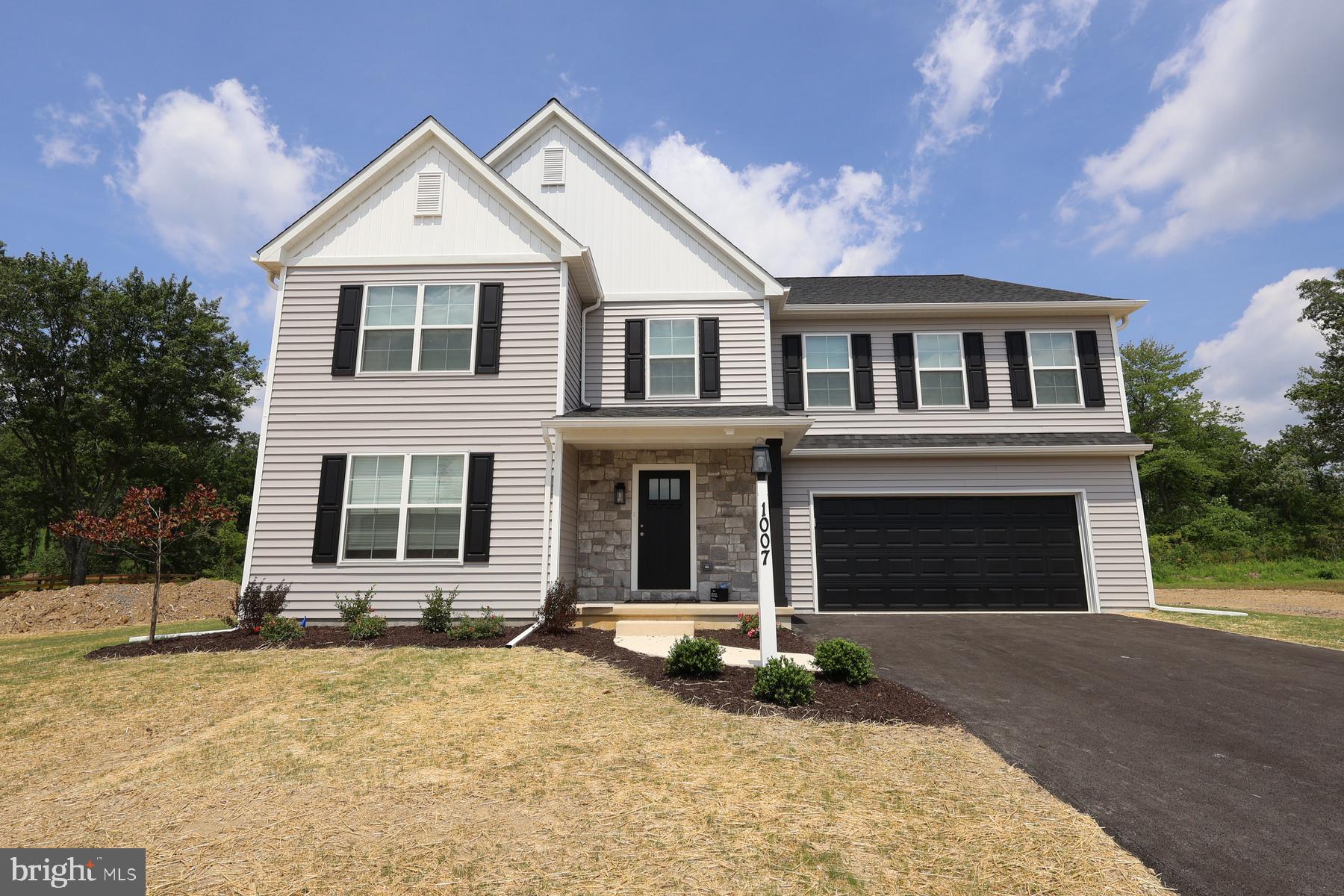 468 Parkside Way Lititz, PA 17543 - Photo 1 of 2 a front view of a house with a yard and garage