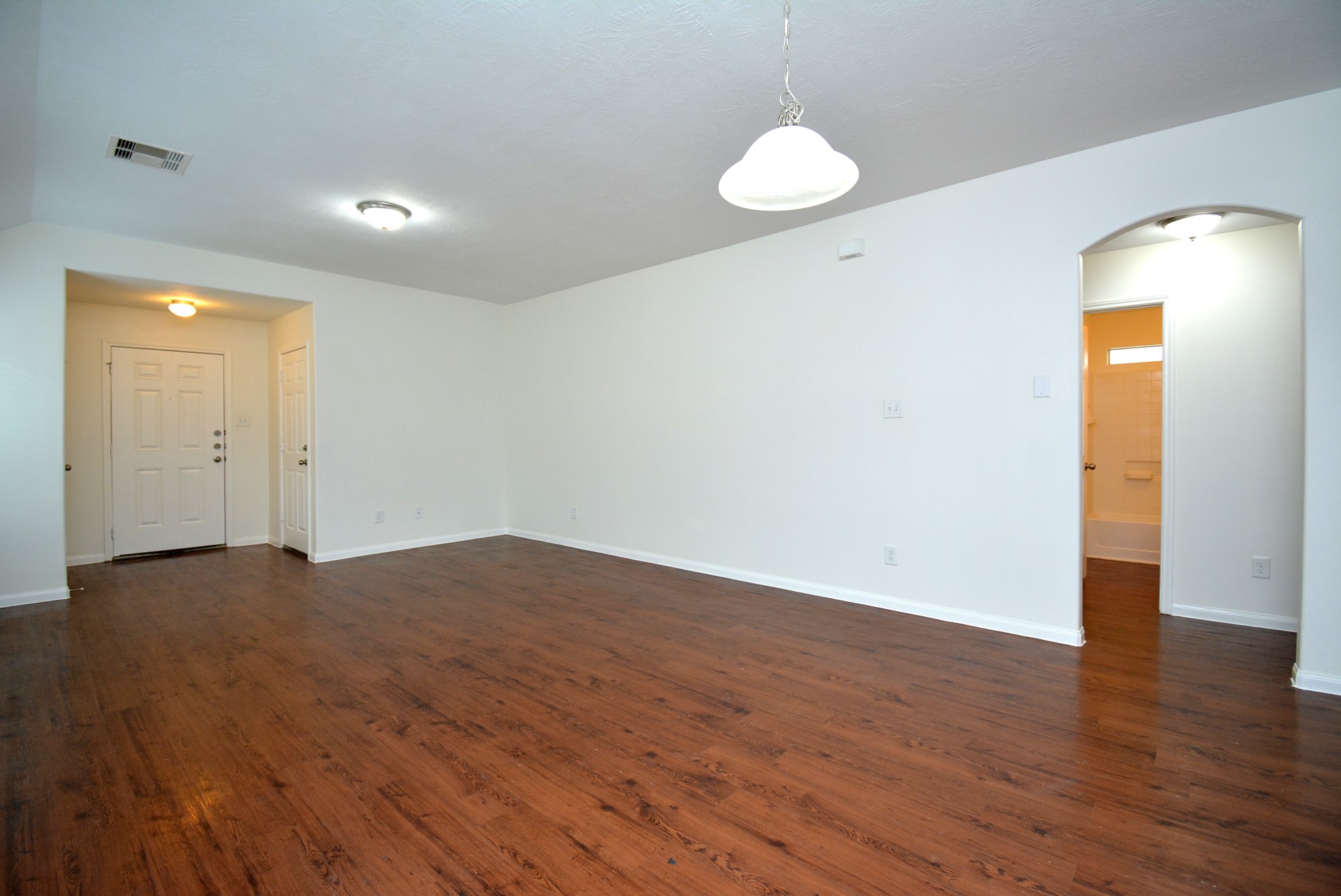 12010 Gregory Crossing Way Houston, TX 77067 - Photo 7 of 26 a view of empty room with wooden floor