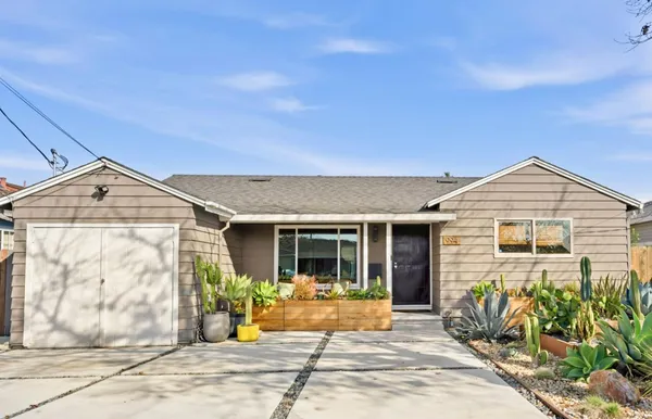 a front view of a house with garden