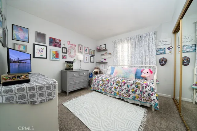 a bedroom with furniture and a bed