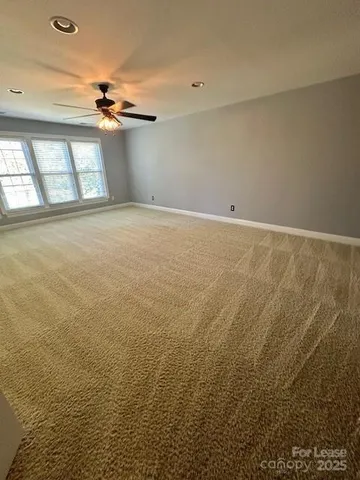 a view of an empty room with storage