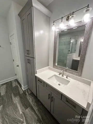 a bathroom with a sink and a mirror