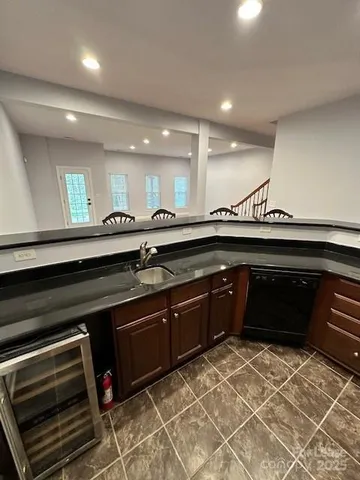 a view of a room with wooden ceiling