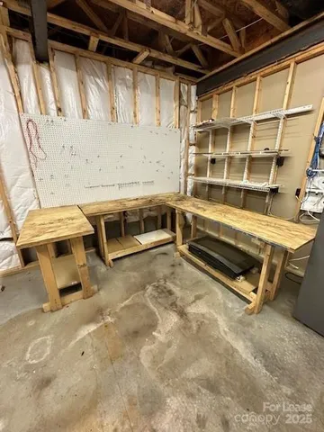 a room with a table and chairs