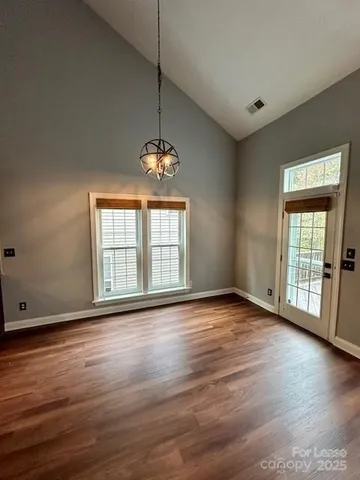 a kitchen with kitchen island granite countertop counter top space a sink appliances and cabinets