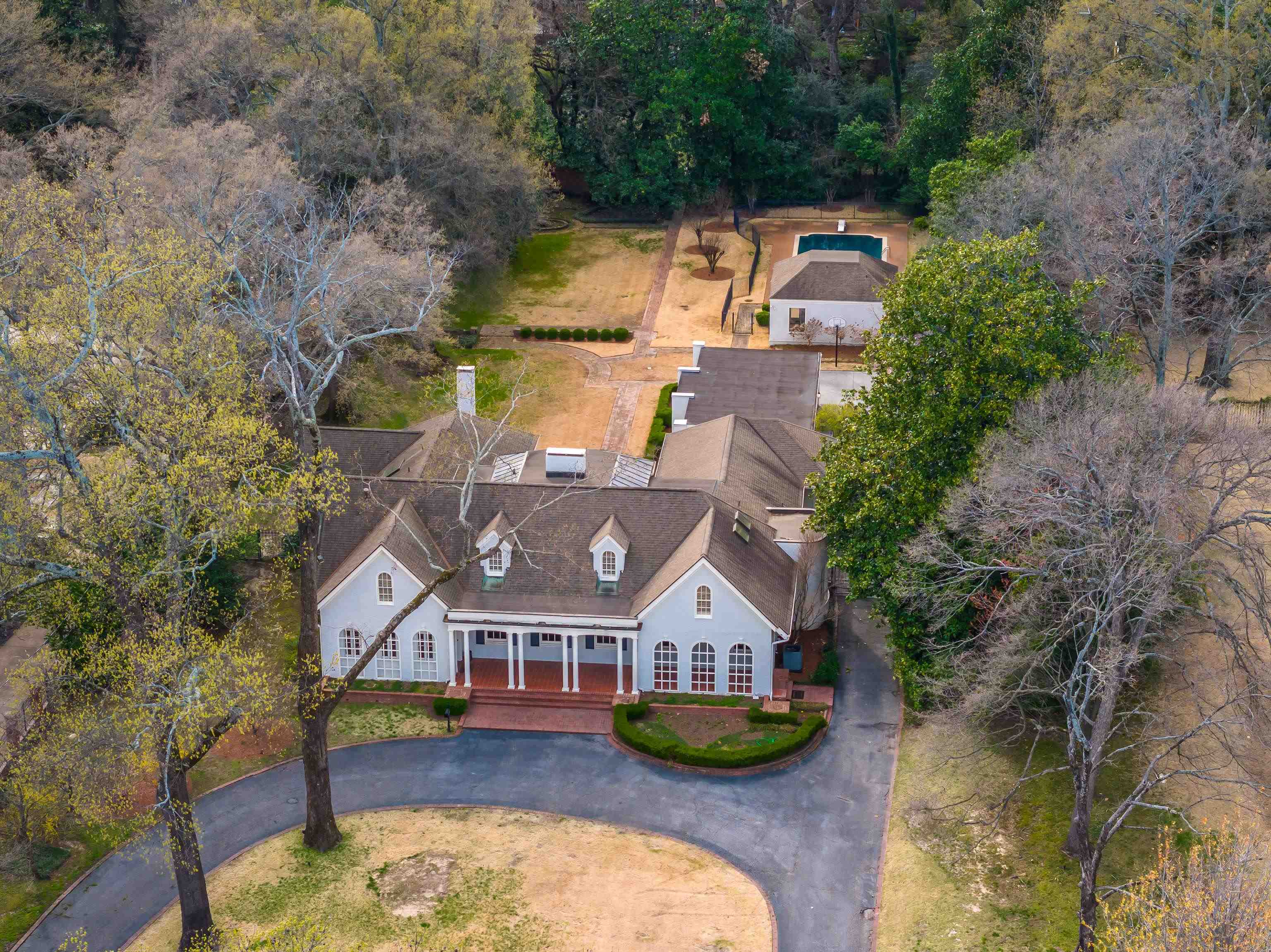 505 Goodwyn Street Memphis, TN 38111 - Photo 1 of 40 an aerial view of a house with a garden and lake view