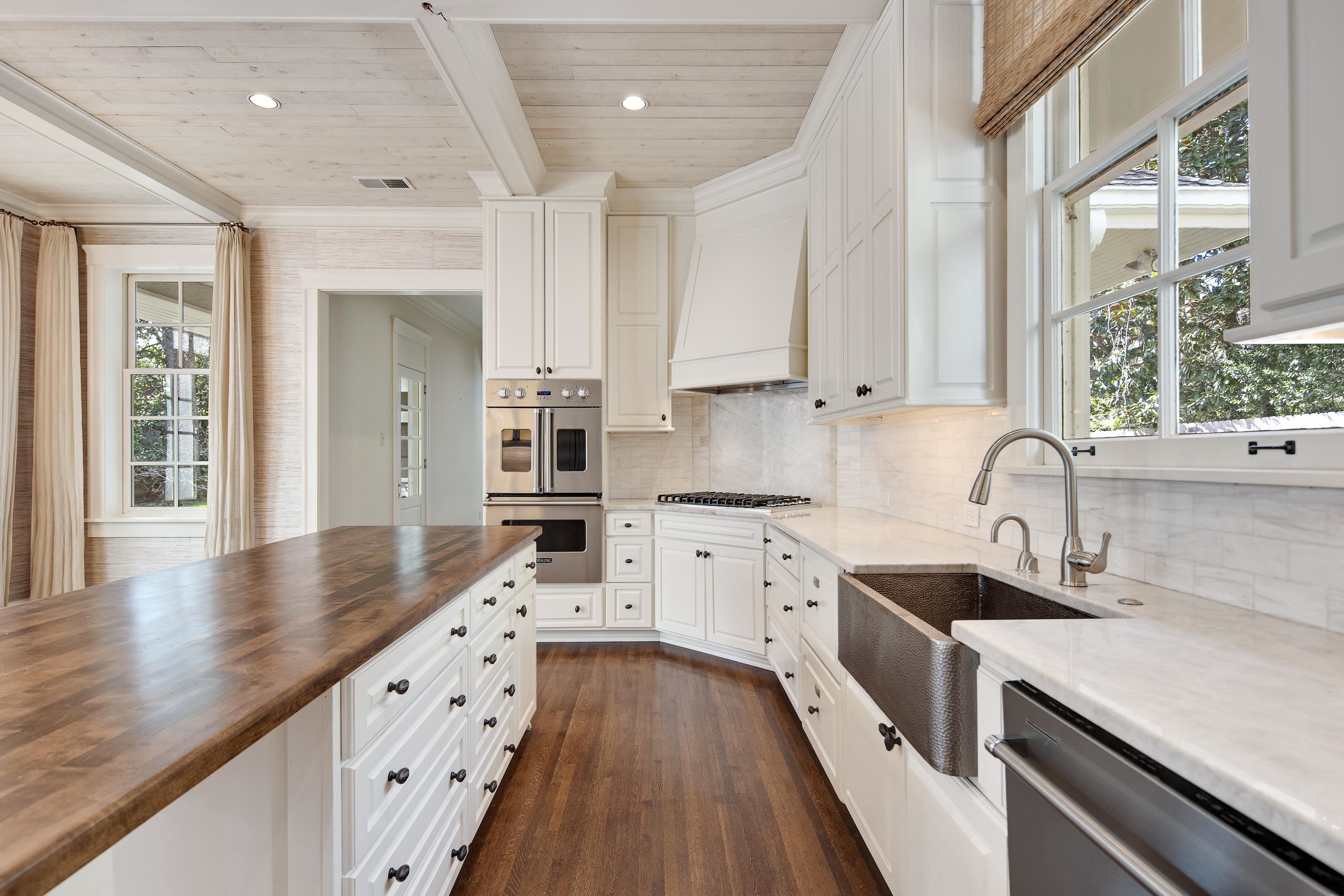 505 Goodwyn Street Memphis, TN 38111 - Photo 13 of 40 Kitchen with wooden counters, beamed ceiling, appliances with stainless steel finishes, custom exhaust hood, and a sink
