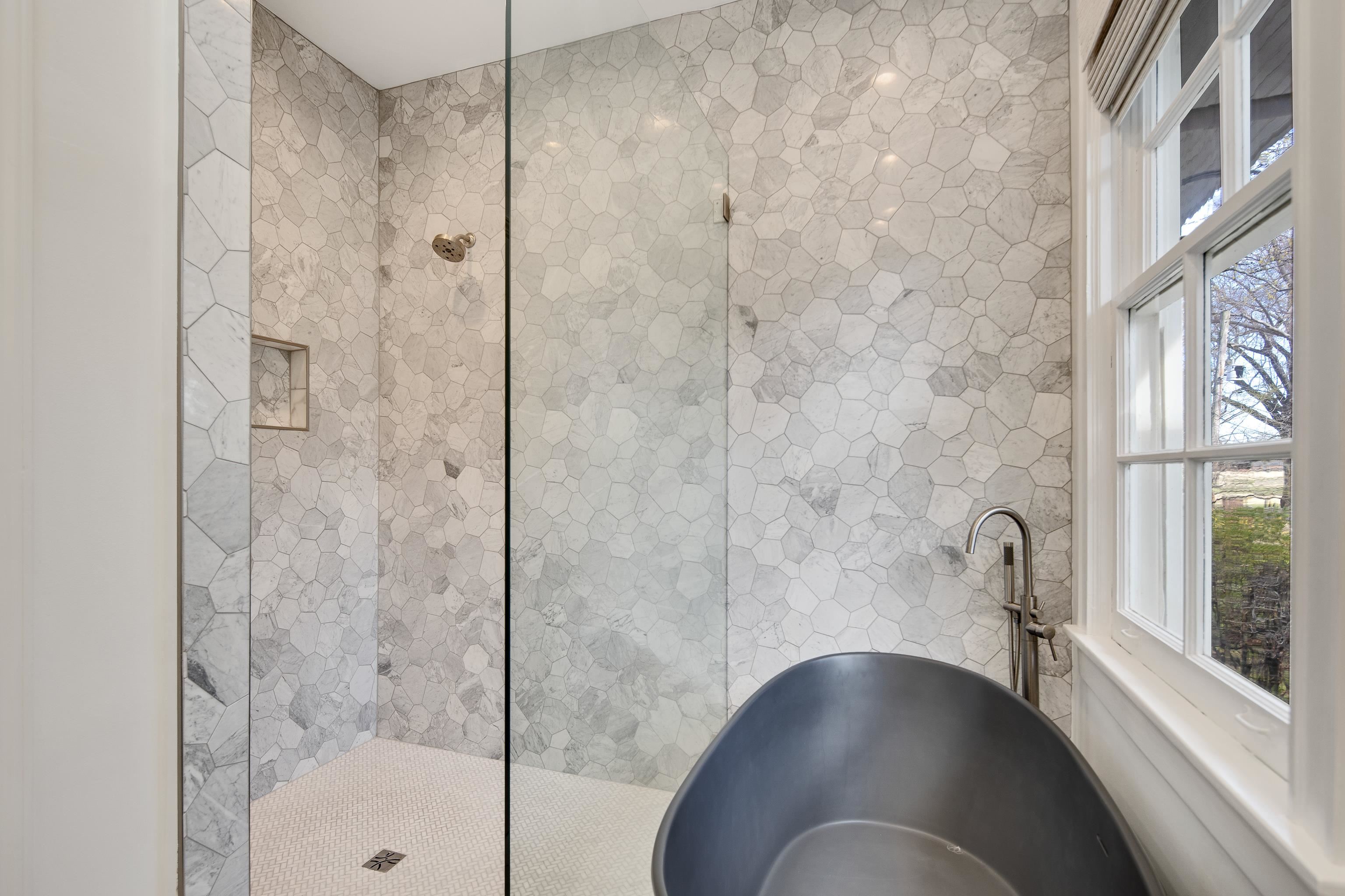 505 Goodwyn Street Memphis, TN 38111 - Photo 21 of 40 a bathroom with a glass shower door