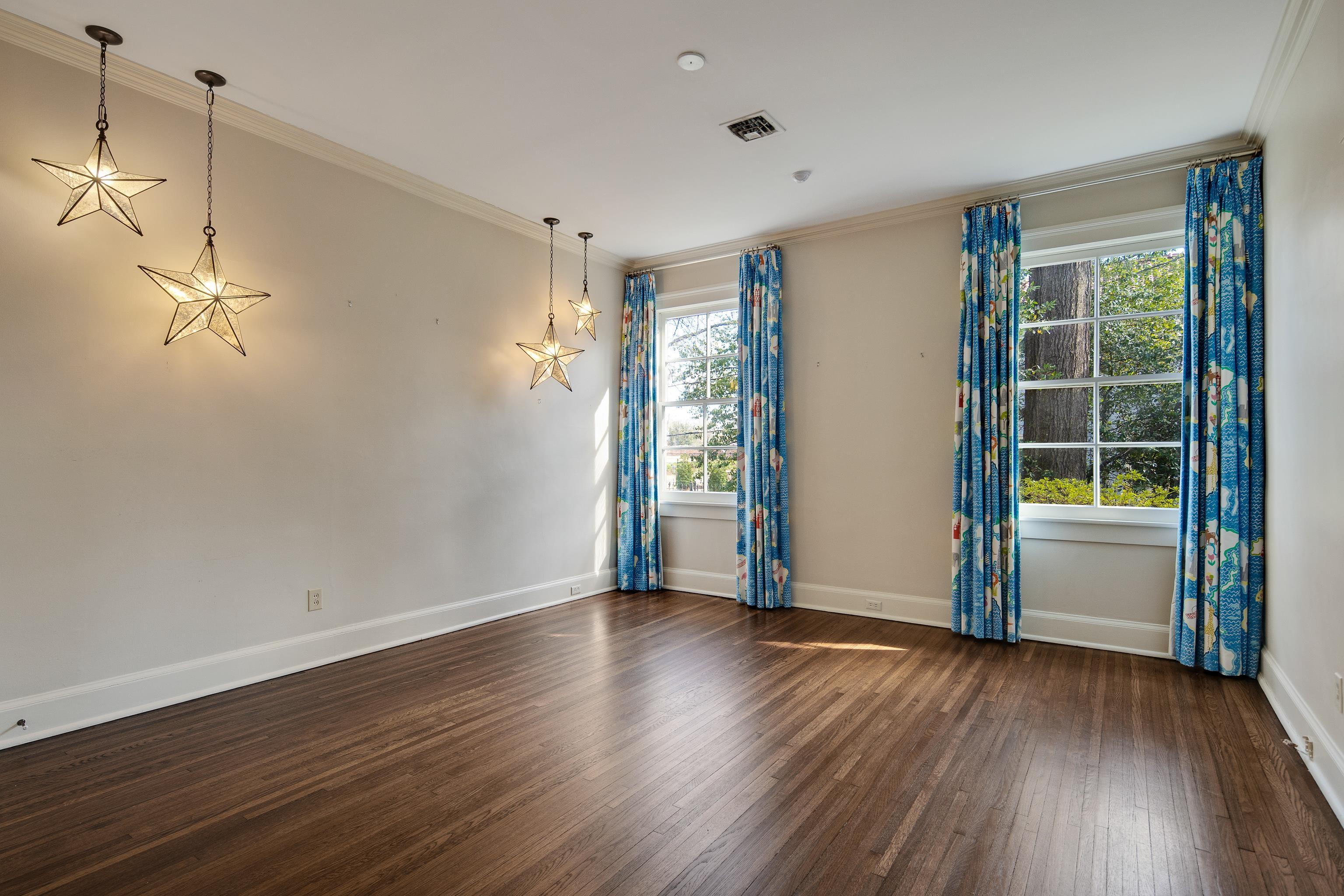 505 Goodwyn Street Memphis, TN 38111 - Photo 23 of 40 a view of empty room with wooden floor and fan