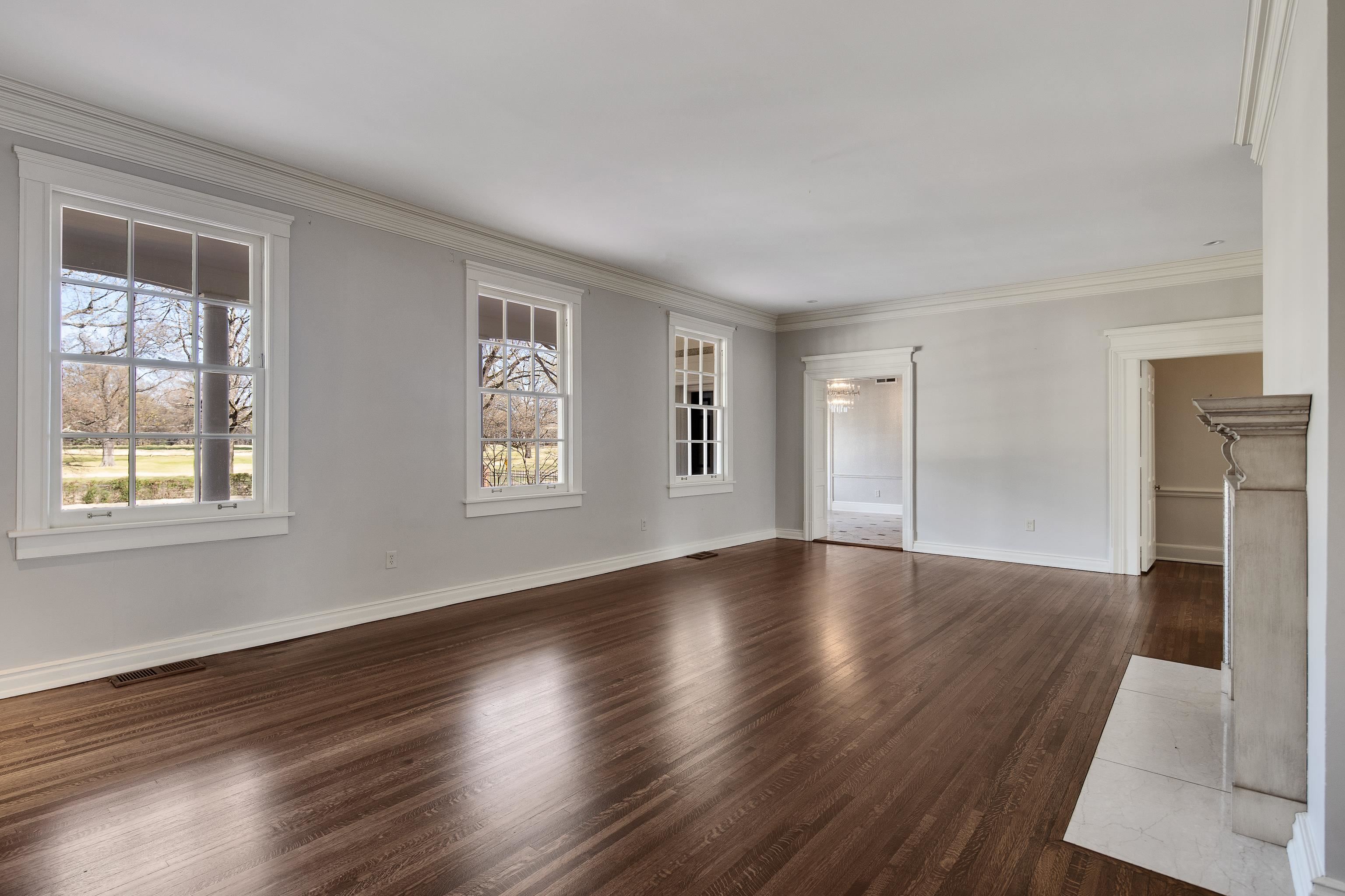 505 Goodwyn Street Memphis, TN 38111 - Photo 7 of 40 a view of an empty room with wooden floor and a window