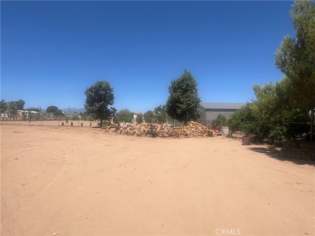 15411 Ash Street Hesperia, CA 92345 - Photo 7 of 11 a view of a yard with a snow