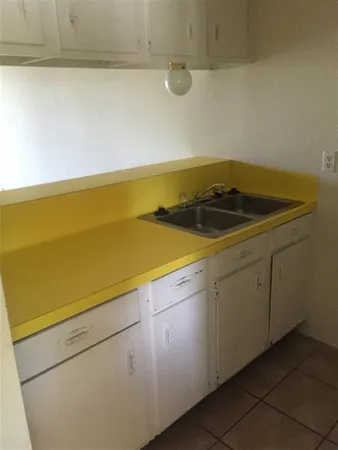 a utility room with cabinets