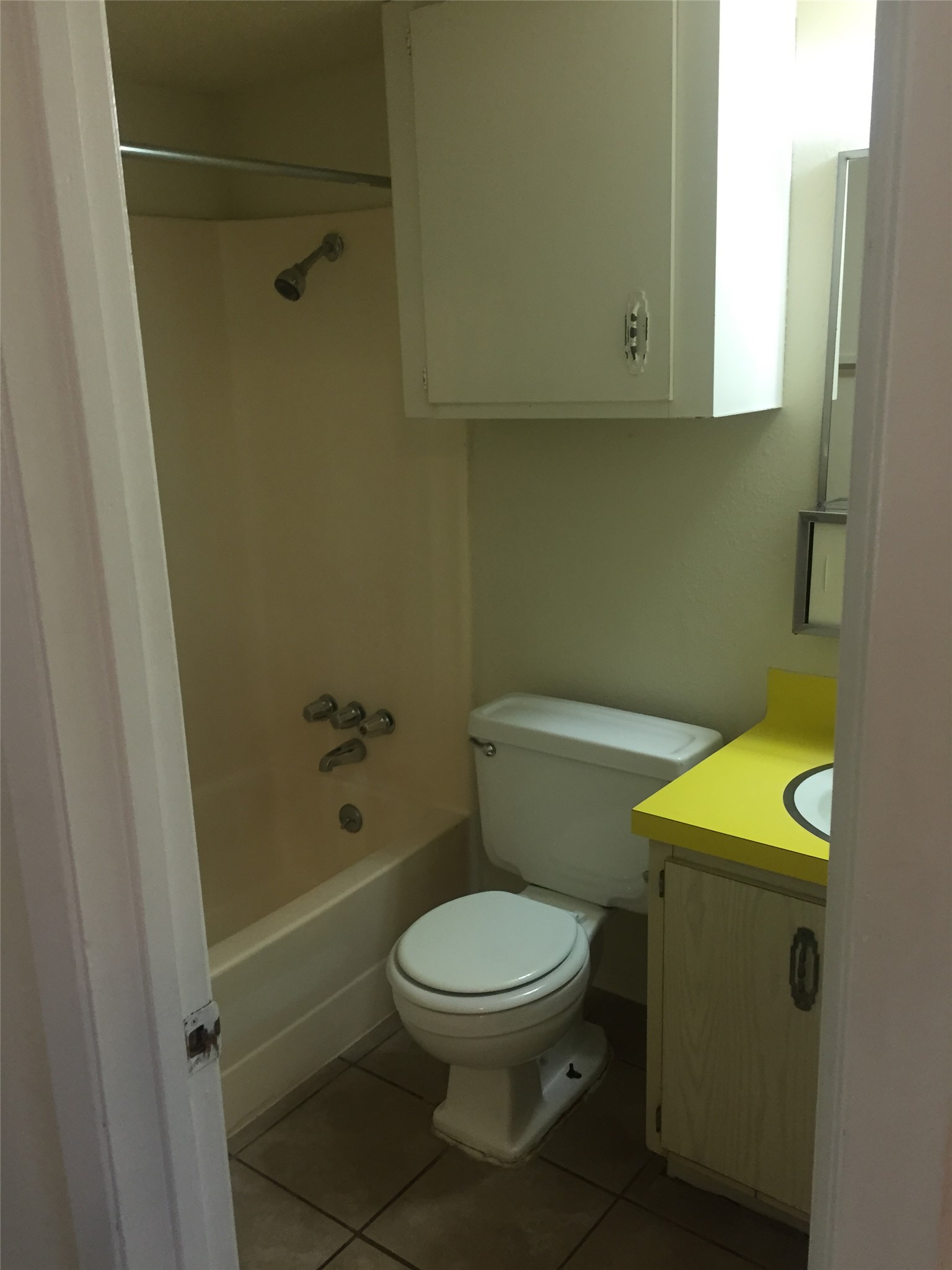 630 Maiden Lane, Unit H Austin, TX 78705 - Photo 7 of 8 Bathroom with vanity, bathtub / shower combination, and light tile patterned flooring