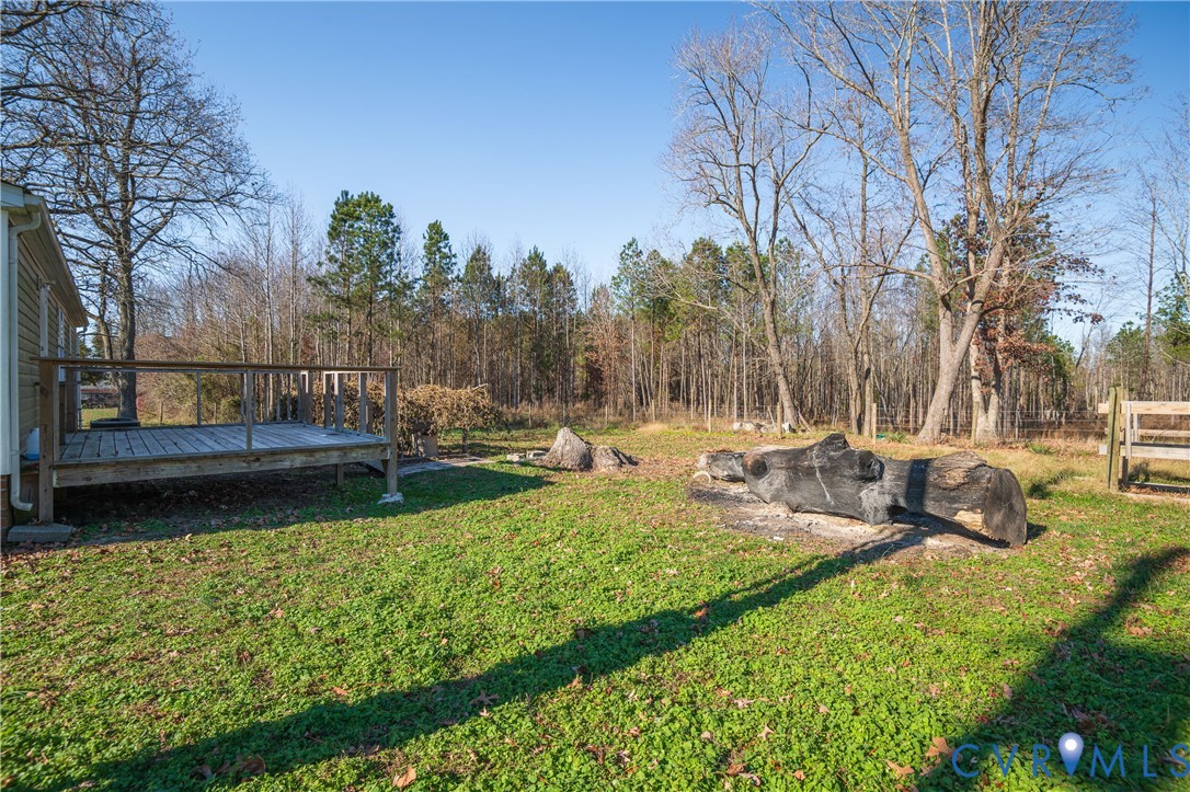 14306 Wilkinson Road Dewitt, VA 23840 - Photo 37 of 60 Expansive green lawn with a wooden deck, natural w