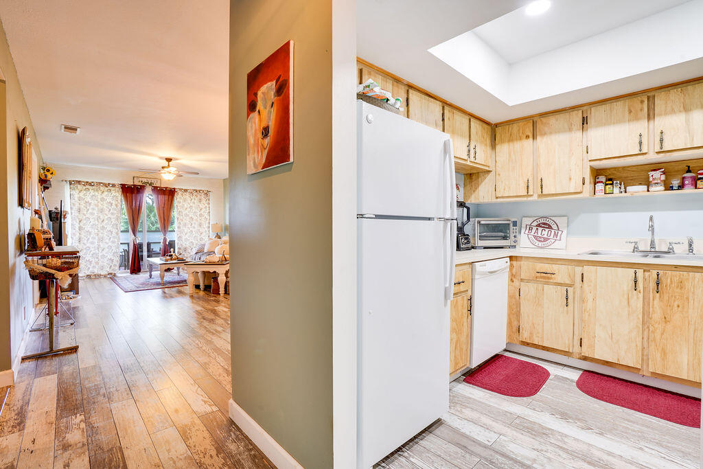 a view of kitchen with furniture and wooden floor